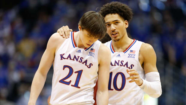 Kansas redshirt sophomore forward Jalen Wilson (10) talks with freshman forward Zach Clemence (21) during the second half of Saturday's game against Oklahoma inside Allen Fieldhouse.